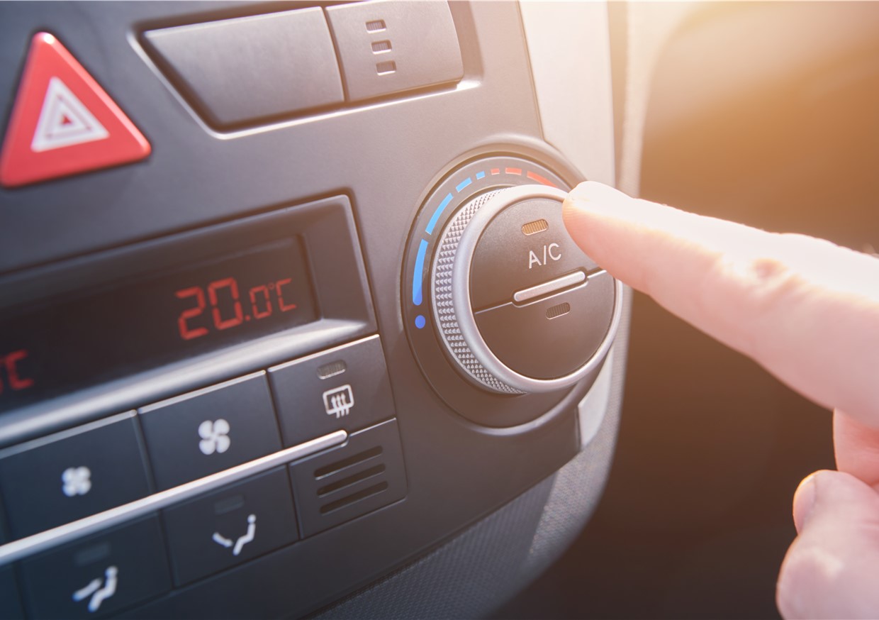 An image of someone checking the air conditioning and heating system. We help to prevent coolant leaks and poor performance. Covering Merseyside and Cheshire.