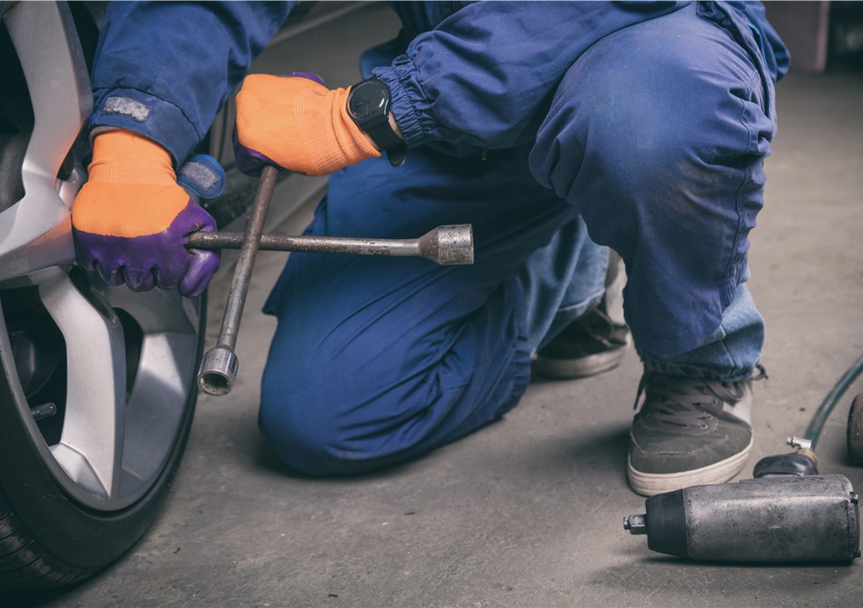 An image of a mechanic repairing wheel alignment which is never obvious. Get your wheel alignment checked out at our garage. Covering areas like Bidston and Bidston Hall.